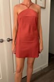 This dress fits super cute and is a good length. I bought it for a summer wedding and love the neckline. It is a nice material for summertime too. So cute! - Teagan S.