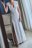 I purchased this dress to wear for our vow renewal ceremony. I love the lace detail. It fits true-to-size and is quite comfortable. Even though it's very low cut in the front, it wasn't an issue because I didn't wear a bra. - Michelle K.