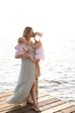 I bought this dress for family pictures and I could not have been more obsessed! It flows perfectly in the wind, has a beautiful neckline and the fabric feels rich. It fits perfectly and the slit up the front offers a little interest without being obscene. I wore it with flats but it would be cute with boots as well. - Anna A.
