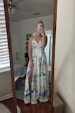 The dress is very nice! I had to order an XS because the S was sold out when I went to order. The material is not stretchy but it fits very well! The dress is a little short for my 3 1/2 inch heels but maybe that is due to the sizing, I just wish it was a little longer. Works fine with shorter heels- just keep in mind if you are taller than 5'4" - Elisha M.