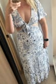 I bought this dress for a bachelorette party weekend, and I love it! It's super flattering. It is a little long. I wore it with 3-inch heels, and I still had to pick it up at times when I walked. I'm about 5 foot 7 for reference. - Maggie W.