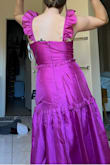 I chose this dress amongst others from other online stores, and this one blew all of them out of the water. The structure holds its shape but isn't restricting, and the color is amazing. I didn't need a bra or nipple covers because the material is thick. The material is also flexible but supportive. I can't wait to wear this dress to many more events to come. It's also more pink than magenta IRL! Beautiful vibrant color - Tatum S.