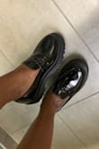 These loafers feel very 90s-inspired, which takes me back to my younger days when I didn't have the funds or fashion sense to get some. They fit perfectly with no socks and I wore them all day fresh from the box, no socks, no problem. Super comfy! I didn't want to take them off when I got home! Interestingly, I also got the white ones in the same size but they were slightly big and I have to wear no-show socks to be sure they don't flip off the back of my foot but not the black, shiny ones! They're just perfection. - August S.