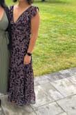 Bought this dress for a wedding it was perfect. I recently had a mastectomy so the ruffles around the chest with the addition of the pattern was perfect to camouflage. 

I got a medium and potentially would have been ok with a small. I took the medium and got it taken in and hemmed. But I always have to get bottoms hemmed being as short as I am! - Kimberly T.