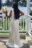 This dress fit beautifully. The material is very substantial and luxurious. This dress was also very comfortable. I had the straps taken up to bring up the neckline a bit. - Shani L.