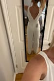 I was searching for a jumpsuit for my rehearsal. While this fits nicely as a small (originally ordered a medium but it ran big), it just didn't have the bridal look I was going for. It is a little plain but good if you are looking for something simple! - Michelle N.