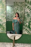 I love this dress! It's the perfect lightweight material for Florida. The off-shoulder look is my fav and it's super flattering and flowy. I wore it on a recent trip and my husband loved it. I think it fits true to size, the sleeves are a tad tight but I have broad shoulders and muscular arms so that is normal for me, I will just not put it in the dryer. - Erin L.