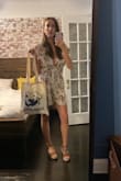 I love this romper and it's flouncy style. Color is more beige in broad daylight and flower pattern comes across as dark brown which was good for the accessories I decided to pair with it. While the shoulder fabric slid around a bit for me I found the overall fit and inseam quite comfortable. I wore this both to the theatre and to a casual gathering so it works well with both occasions and for travel. Highly recommend! - Simone B.