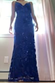 I ordered this for a senior ball and it fit perfectly with my heels straight out of the package. It's not itchy at all and the adjustable straps are a plus! - Katie J.
