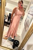 It's too long even if I'm wearing my heels and it fits me very loosely. :( - Ana V.