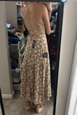 I'm wearing it to my dad's wedding, and it's perfect! It fits tightly around the upper body and is the perfect length to wear with wedges or short cowboy boots! Works without a bra or with a sticky bra. - Molly J.