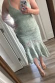 This made my body look beautiful. It accentuated my hips nicely and looked really elegant. The large fit comfortably and true to size. Can't wait to wear it in November for the wedding! - Hannah R.