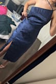 The overall dress is nice. Fabric is a bit thinner than I expected but still good quality. I did not have an issue with wearing the straps like the model, but the dress was huge on me. I usually wear small, but I should've gone for the extra small on this one. I had to return. - Rocio A.