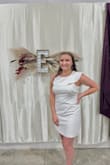 This dress looks really good on! It fits perfectly, using the sizing guide. Very comfortable material and not see-through. It worked great for my bridal shower! - Maude H.