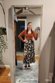 This skirt is sooo cute. I'm 5'1, and the length and slit are absolutely perfect! I initially ordered an xs (which is my typical Lulus size), and it was extremely tight; definitely smaller than my other xs Lulus skirts. I exchanged it for a small, which is a little bit loose, but overall fits great. Such great quality and perfect for fall! - Rachel D.