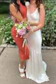 I tried on wedding dresses at a few boutiques and didn't find anything that felt very 'me'. I knew I wanted something simpler than what I was seeing and didn't want to spend an obscene amount of money. I searched all over the internet and found the 'Love All of Me' dress, which looked almost perfect. I was hesitant about going for 'champagne' in lieu of a true white. I wasn't sure about the scoop neck, but I went ahead and ordered along with 3 other white Lulus dresses to try. I was blown away by the quality, look, and feel of this one in comparison to the others. The fabric was gorgeous, comfortable, and thick. The color was an elegant and elevated ivory. I did feel it might be a tiny bit too far on the simple side for me, so I pinned a $30 silk flower from Etsy to the top of one of the straps to complete the look. My wedding was this past weekend, and my guests couldn't believe it when I told them it was from Lulus! Give this one a try! - Alexa K.