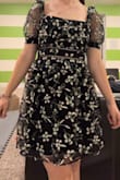 I honestly LOVE this dress. It looks adorable and is exactly what I wanted for my school dance. The only thing is that the neckline is kind of loose, so if I move the wrong way, you can see right down the top (which is big if you're short like me). Another thing is the sleeve. They aren't cut into your armpit so lifting my arms is a little uncomfy. Other than that, though, I love this dress!! - Madilynn E.