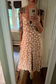 I bought this dress for a farm wedding and it's perfect! Fits true to size. Might need tape in the front so it doesn't fall down in the chest but other than that it's perfect! - Beth F.