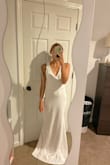 I tried this on as my potential wedding reception dress. I loved it, however, the straps were a little too big for me, which made the back gap a little on the sides. But I loved the buttons going down the back! - Alexa T.