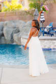 I purchased this dress for my 20th vow renewal. The dress looked great. I loved the back and the slit. Perfect for the summer. It was a little long. I would, normally, have gotten it hemmed but didn't have the time. Normally, I wear a small but had to size up to a medium for my waist. This was the case for most of the dresses I tried on from Lulus. Fast shipping. - Monica T.