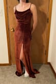 The material is a nice, thick, lush velvet. The brown is a really beautiful auburn color and overall it's super nice. It's quite a long dress, so wearing my 6" platform heels they were a good inch or so above the ground, but if you're shorter or have shorter heels there's the risk you might need to hem it. The cowl is a false cowl. Personally, I liked this as I don't have to worry about leaning over and anything showing, but it's something to keep in mind if that would bother you. My biggest problem is the waistline. It fit a little boxy on me as the narrowest section is at the top of the ribs. It was still a really flattering dress, it just didn't hug me as much as I wanted. I think an XS would be too small on me though. Also good to keep in mind that the slit is decently high and forward. - Davyn L.