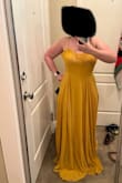I got so many compliments on the dress and colour. It's beautiful but a bit heavy with the material. I was fine for a spring wedding with 20 C weather. BUT if you're a curvy/hourglass girl, buy the size to your WAIST. I'm usually a medium in tops and large bottoms (size 10-12 jeans) and I wish I bought the medium. I didn't have enough time for a return and had to bring it in lots at the waist. There's so much room for your hips so don't worry about that. First is how I got it. The second picture is after it got taken in. - Kaitlyn M.