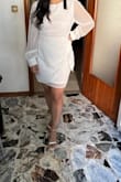 The dress is very flattering because of the wrap front. Shoulders are a bit poofy because of the sleeves. Returned because I didn't like the material and it was not really white. - Elsa G.