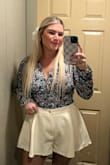 Loved this blouse! Fits true to size and was very flattering on. I had so many compliments while wearing it. The material was nice; it didn't have any stretch to it I'll say, which was expected though. Overall a great blouse that I would repurchase - Gabbi A.