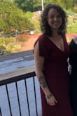 There's a snap at the front and ties around the sides. I felt secure in it; although, when a big gust of wind came through, I almost flashed my friends. I really like the sleeves. I felt beautiful in this dress. - Jordan W.