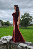 I bought this dress for my best friend's wedding. I couldn't be happier with it, hugs all the right places. The slit is high enough to be sexy but not too revealing. I have one complaint the zipper kept getting stuck cause of frayed strings in the bsck. I like the cowl neck, but I was skeptical about how it'd photograph if it looked like a bib. - Kelsey K.