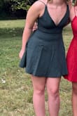 This dress fits true to size and is very comfortable. I was never worried about the straps slipping or not being able to move as needed. It is very cute and can be worn to many things. - Rachel E.