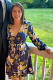 This dress is beautiful and flattering; it seems versatile for different body types and occasions. The fabric was nice and did not stain when I dropped pasta sauce. I received lots of compliments at the wedding I attended; my shoulders and bra line are small so the v of the dress slipped slightly while seated which is why I would personally size down. - Jessica G.