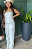 I wore this on my bachelorette trip, and it was super cute and fit super well. All was great UNTIL I had to go to the bathroom. The zipper wouldn't go back up, and it took 8 girls in a tiny bathroom trying to fix it until finally, the zipper broke off. We tried to safety pin it, but the area where the zipper was is SO long that you would have to have WAY more safety pins to make it look fine. Luckily, one of the bars we went to had souvenir t-shirts. I bought one of those and wore it over the top. I included photos of what it looked like before and after we safety pinned it. Fairly disappointed because it's super cute and wasn't the cheapest, but the zipper felt very cheap. - Erin B.