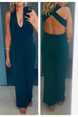 Comfy jumpsuit. The back is gorgeous. Cons that prevented 5 stars: I wish there was more structure/hold at the top. Boob tape was a must. It does not photograph as green as in the website photos and looks more teal. I wish it had pockets. - Desiree F.