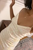 Short and sexy but not so short to be classified as slutty. The sequence is gorgeous with hits of light pink. - Dennise