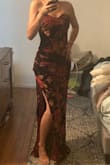 This dress is beautiful and really comfortable. I bought it to wear to my cousin's wedding and got lots of compliments! It is heavier than I was expecting. It has an inner lining and 2 panels overlapping in the front to make the slit, so there are actually 4 layers of fabric in the torso area. There is also some ruching on one side that I hadn't noticed in the photos online, which made it bulkier and less form-fitting than I had expected. Overall though, really happy with it! - Laura I.
