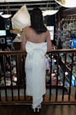 As a bride, it's very hard to find a white dress for all the different bridal events. I settled for this one for my welcome cocktails. I got an XS and couldn't size down anymore. It was a little big and the removable bow really weighed it down. I was constantly pulling up the dress throughout the night. The front didn't give much shape either. - Sarah D.