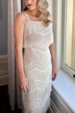 Okay, I was not expecting to find my wedding dress on Lulus! I had purchased two other Anthro wedding dresses that I kept questioning. I searched and searched for midi dresses with both fringe and a higher neckline - I am so happy I found this one! It was perfect for our mid-September wedding. It has a timeless 1920s / Art Deco vibe. The dress is light, comfortable, and appropriately hugging. I ordered an XS and a S for fit and ended up going with the S. I did choose to have new straps put on that my local alterations place was able to do super easily. The original straps are adjustable and had the tiniest frays in some spots (though minuscule - only I noticed). I paired it with a beautiful pair of Loeffler Randall pleated heels that totally completed the look. Highly recommend it - it's a rare find! - Angela L.
