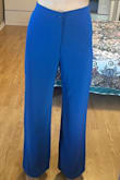 I have broomstick legs so this pant was much too wide even though the waist was a comfortable fit, enough room to tuck in a shirt. Pictures are size S and now I exchanged for XS to see if the fit is any better. Super long, need 3+ inch heels or hemming to wear it. Color is beautiful and the inside lining is truly great. - Sofia N.