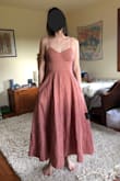 Cute dress! The fabric was very thick and had a good weight to it. I wish it was a bit shorter in the skirt (I'm 5'5") to be a more flattering tea-length. - Darcy G.