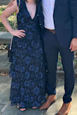This dress is gorgeous and super flattering! Got so many compliments. It is a little big, especially if you're on the shorter side. Had to be creative with the safety pins, but once I get it altered, it will fit perfectly! Also, the length is perfect. I did not even need to get it hemmed prior to wearing. - Marie C.