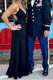 I have a curvy/athletic build. The Medium was perfect for my husband's military event. I got so many compliments. If you are really top-heavy, you may want to think about sizing. The top portion of the dress fit similar to a tie bikini top/with only one tie. There wasn't a lot of support. Other than that, I absolutely LOVED this dress. - Libby V.