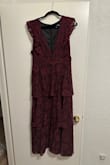 I ordered an XL in burgundy and love the color, fabric, and style. It was very flattering on my tall curvy shape, and has a black underlining so not see-through. I don't have large breasts, so the deep V wasn't really an issue. I'm planning to wear a black lace cami with it. The length is perfect and falls above my ankles. I'm 5'10-11 with heels on. I thought about sizing up to a 1x, but am glad I went with the XL! - Christen T.