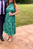 I absolutely loved this dress! I wore it as a guest at a wedding. It was a little loose, but I think that's how the fit is supposed to be. There is a tie around the waist that you can adjust - so I just tied that to my liking. I got so many compliments on the color! - Emily B.