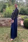 I received so many compliments in this dress. First, I am 6'3" and I did not expect this dress to be long! It sure was and even with a small heel, it maintained its length. Stunning! Secondly, the color is gorgeous. Third, the tie around the neck is so chic. I love the open-back. It was cold at the wedding I attended so I paired it with a black leather jacket and surprisingly really complimented the dress and kept me warm! - Emily K.