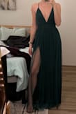 This dress is gorgeous but the slits are NO JOKE! Fit me perfectly but definitely on the longer side. I'm exactly 5'5" and it was the perfect length with 4 inch heels, so if you're shorter definitely order with enough time to get it hemmed! - Amanda J.
