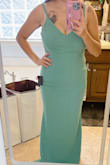 The dress and material is nice. The only thing is that it is VERY long! Nothing like getting it hemmed up. Cant wait to wear it! - Diana B.