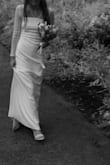 This dress was literally perfect. After trying on many at a bridal shop, and not liking anything, I decided to try and find something online. This was the first and only dress that I bought. It fit me perfectly (I got an X-Small) without having to make any alterations. I did wear 3 inch heels so it could be too long for anyone who wears flats. It was incredibly comfortable, I wore it the whole day and did not have a single issue with any rubbing or anything like that. The only thing I would have changed would be that the back would have been lower, but that is more of a preference. I will definitely be buying from Lulus again. - Kate L.