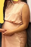 Lovely dress! I wore it 38 weeks pregnant and it was very comfortable. I sided up 1 from my normal (s) size so I got a medium. I also tried in a large just to see and the top part was just way too loose. You can already see the medium being a loose fit for me already because I don't have a large bust >r but very comfortable! Unfortunately for me, the buttons were not put on well? They fell off so I need to find replacement buttons for the dress. Because my belly was taking a lot of space, I did not need heels or need to hem it. - Andrea N.