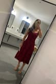 I ordered this dress for a late September wedding and was very pleased with the color. It's a light maroon and some of the threading has a slight glimmer in it. Fits true to size and the straps are adjustable. Not very tight around my bust and lots of room to move! - Caitlyn F.